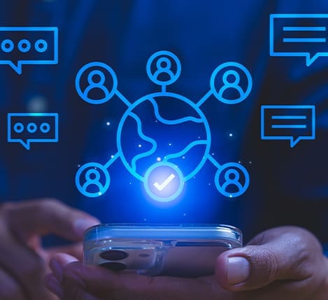 Global networking and social media connection icons hovering above a smartphone